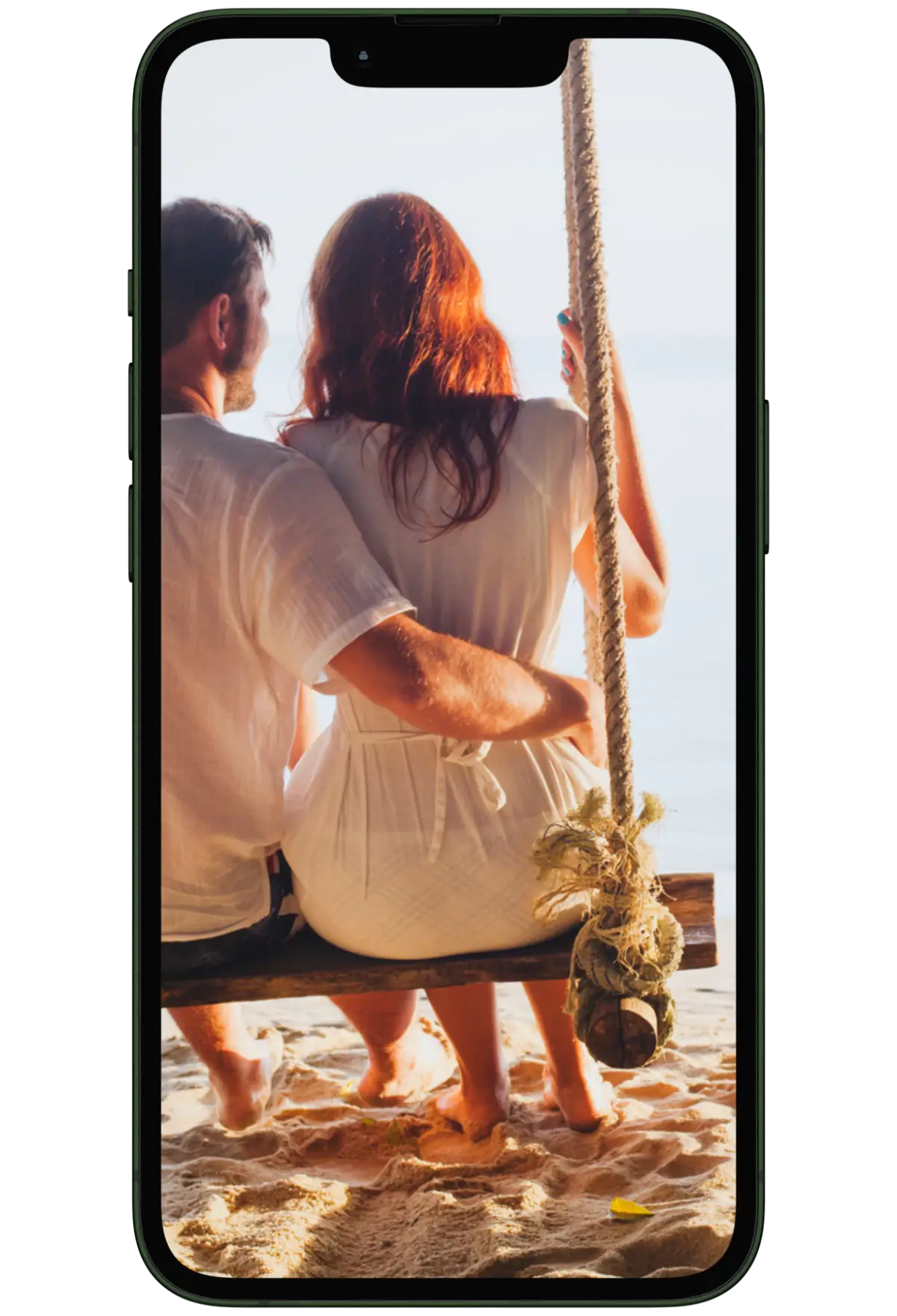 Couple on a swing overlooking the sea